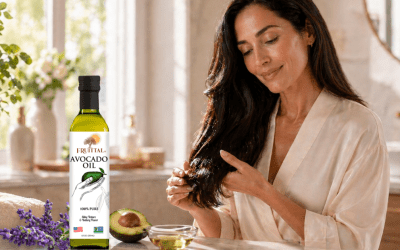 Woman using Fruittal® Pure Avocado Oil to nourish dry hair ends for a soft, healthy-looking shine
